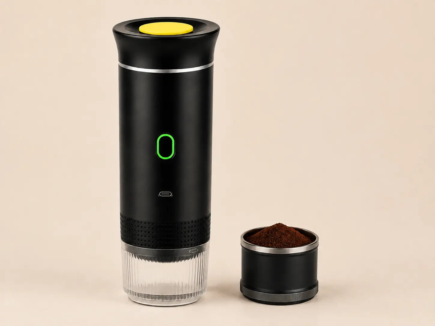 Ground coffee basket beside the KOVA One espresso maker